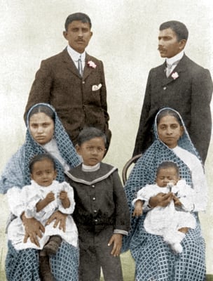 Prabhudas (below center) with mother Kashi (right, carrying his brother Krishnadas on her lap) and his father Chaganlal behind. Chaganlal's brother Maganlal and his wife Santok (carrying their son Keshavlal on her lap) on the left, South Africa, c. 1905.