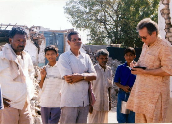 Peter Rühe and sarvodaya workers talking to surviving locals after the Gujarat Earthquake, 2001