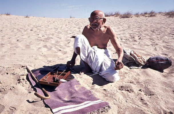 Prabhudas Gandhi spinning on the beach near Dwarka, Gujarat, 1989.