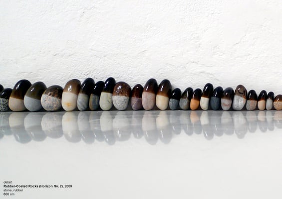 <a href="http://www.nidasinnokrot.com/text/rubber-coated-rocks/" target="_blank" style="color: #FFFFFF; float: right;">info</a>