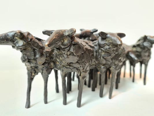 13 bronze sheep
