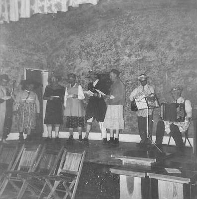 March 25, 1953: the men put on a program for the PTA: “The Ladies Men” Participants: Howard Capell, Dean Riddle, Johnny Luther, Leo Tiede, Mannie Anderson, Malcolm Jacobson, Howard McLaughlin, Lester Piopgras. Photo taken at the Central Grange Hall on Big