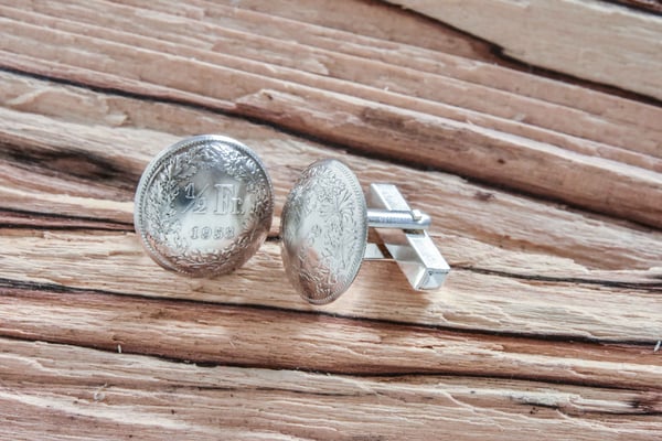 Fünfzig Rappen Manschettenknöpfe 340.-