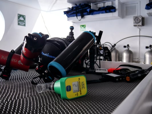 Equipment on the table of the dive deck of the vessel Galapagos Dive Expedition