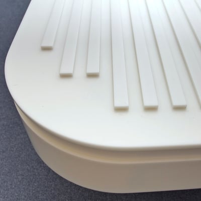 Luggage shelf as a bed extension in a hotel room fabricated from acrylic solid surface / fabricator - Gforma