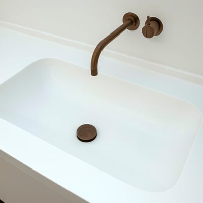 White solid surface washbasin integrated into the vanity / fabricator: Gforma