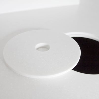 Waste bin with lid integrated into solid surface laboratory desk at a dental clinic / fabricator: Gforma