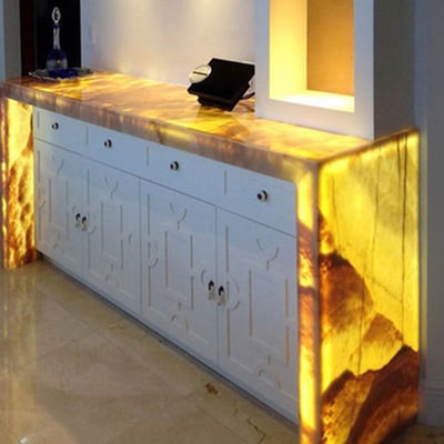 Console coated in translucent onyx with led lights inside