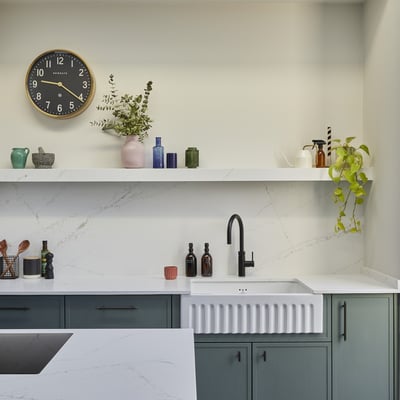 Open kitchen shelf fabricated from Silestone quartz matching the worktop and backsplash