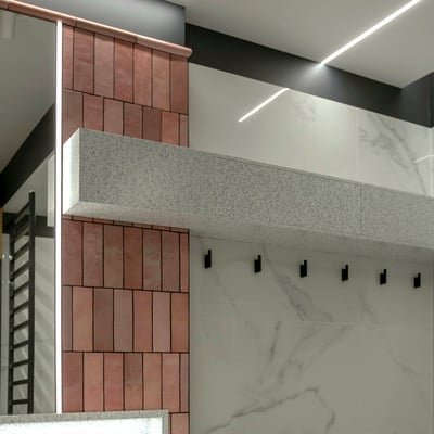 Hanging bathroom cabinet with lifting doors fabricated from acrylic solid surface Staron Mosaic Dalmatian / fabricator - Gforma