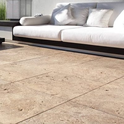 Home terrace floored in travertine tiles