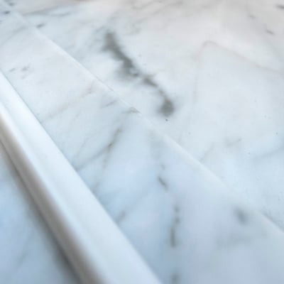 Shower pad from natural white and grey marble 
