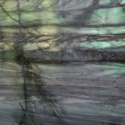Translucent green quartzite wall backlit by natural light 