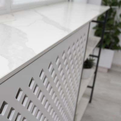 Heater covering with holes made from acrylic stone / fabricator - Gforma