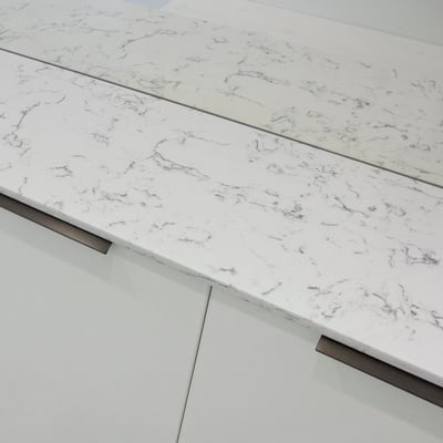 Shoe cabinet topped with engineered quartz 