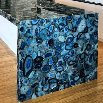 Kitchen island clad in blue agate 