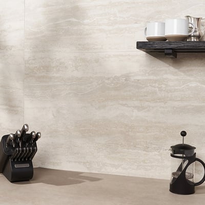 Kitchen wall clad in natural travertine