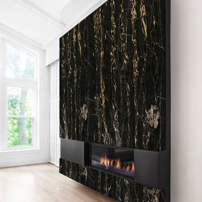 Black marble fireplace wall with golden veins