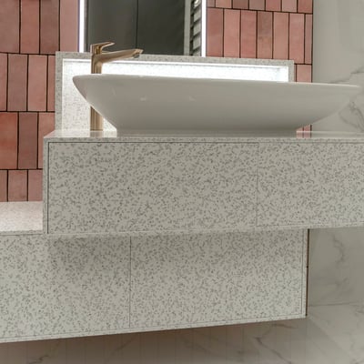 Bathroom vanity fabricated from Staron Mosaic Dalmatian solid surface / fabricator: Gforma