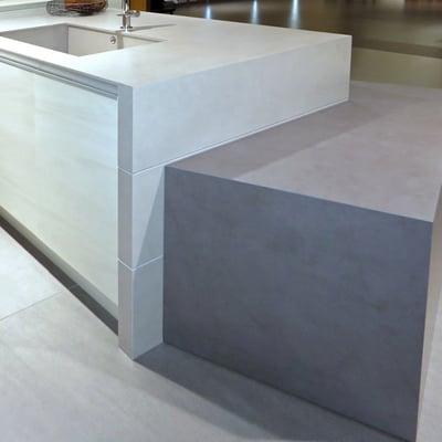 Wide cooking platform with its top and sides coated in Neolith sintered stone, with integrated Neolith sink