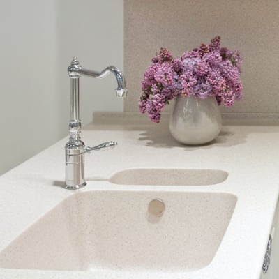 Two section sink in acrylic stone, integrated into a worktop 