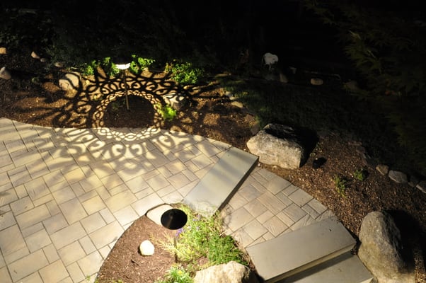 This landing (between the driveway, yard, and deck steps) is the perfect spot for this elegant fixture and it's mesmerizing shadow patterns. Montvale, NJ