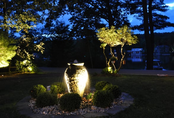 Sometimes it's a unique focal point which garners all the attention. Such as the sight of shimmering water trickling down the sides of this stone fountain. Green Pond Lake, NJ