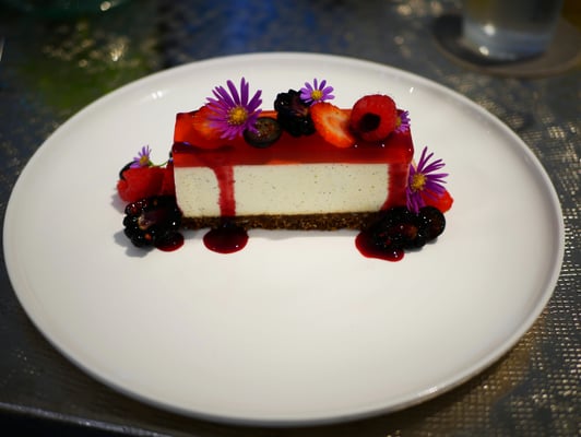 Strawberry glazed cheesecake with berries and oat crumbs at Como Cuisine Singapore Dempsey Hill