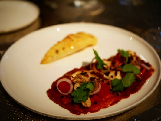 Grilled squid with watermelon, romesco, coriander and olive at Como Cuisine Singapore Dempsey Hill