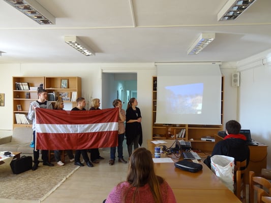 The group of participants from Latvia showing a presentation about the culture in Latvia