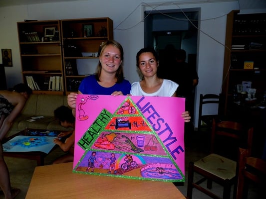 Participants presenting their poster for a exhibition "Health=Happiness"