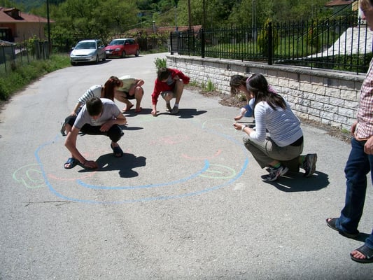 Some participants of the exchange drawing a huge human body