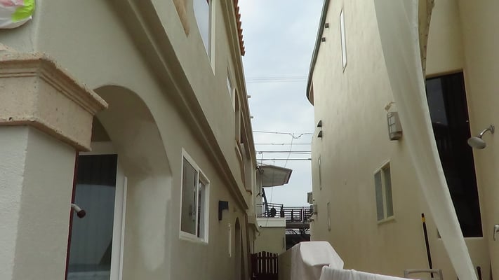 September 2015.  Beachfront Properties at Mission Beach in San Diego painted at the same time in 2007.  Beige House on the right painted with Ceramic InsulCoat Wall.  It is still pristine.  House on the left is now being re-painted with EnviroCoatings.
