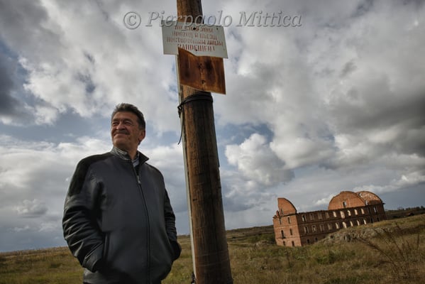 Gilani Dumbaev in the evacuated and contaminated village of Muslyumovo where he lives. The signs warn: exclusion zone, forbidden to enter. He comes from Chechnya and lives for 20 years in old Muslyumovo, on the banks of the Techa River.