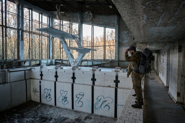 Jimmy in the abandoned pool of the ghost town of Pripyat. Stalkers spend their days exploring abandoned buildings, reading old USSR magazines or books they find, hiding and escaping police and living as they were the last survivors of the planet 