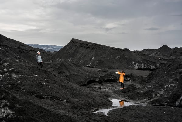Iceland. Tourists take photos on a trip to the Katla Volcano.