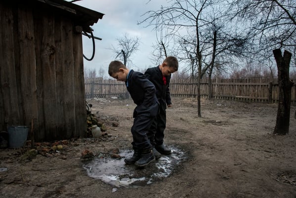 Vladik and Igor in the garden of their house, waiting to go to school. Vladik, 7 years old and Igor, 6 years old, live in Radinka, one of the most contaminated village around the Chernobyl Exclusion Zone.