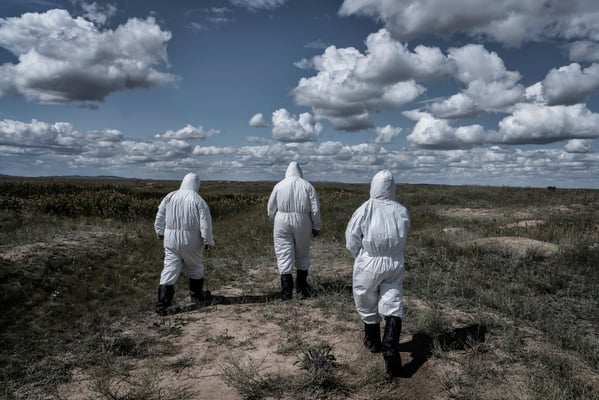 Scientists of the Kurchatov nuclear center wearing protective suits Inside the polygon, while going to ground zero, where the first atomic bomb was exploded on 1949.