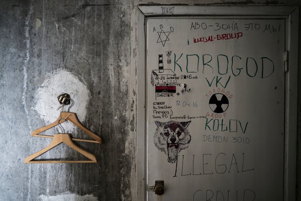 Hangers and graffiti in one of the apartments occupied by stalkers.