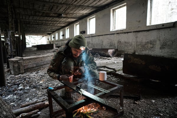 Jimmy lighting fire in an abandoned pig-shed