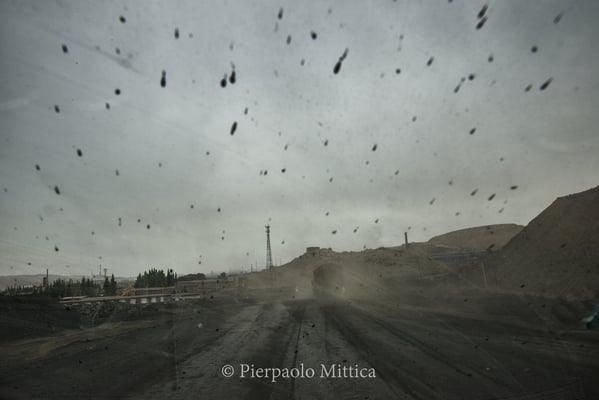 hundreds of trucks go back and forth everyday among the plants along the road leading to the coal mines. the obsolete diesel engines emissions and the coal dust volatilized during the trips create a deadly mix contaminating air and land