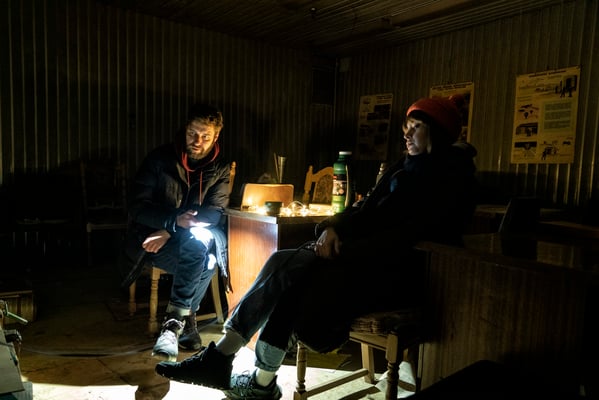 Ostap and Daria inside the bunker as they wait for the air raid alarm to go off. 