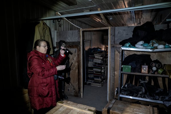 A tourist photographing inside the bunker