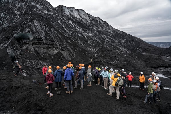 Iceland. Tourists wait to enter the ice cave during a trip to the Katla Volcano.