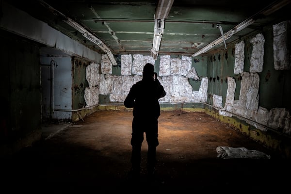 A tourist taking picture inside the computer’s room. During the Cold War, this room was full of computers that were dismantled when the bunker was closed.