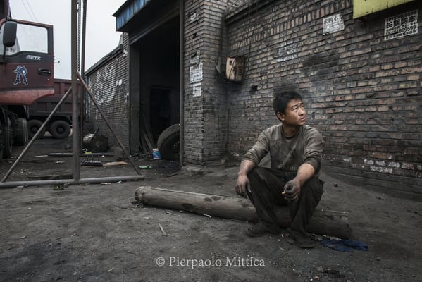 A break for a mechanic working along the road leading to the coal mines.