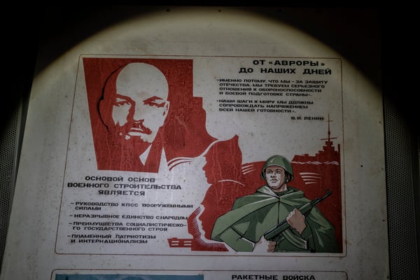 a poster with Lenin's portrait hanging inside the bunker