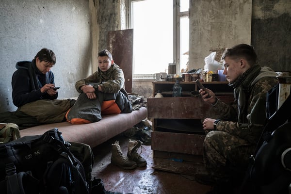 Young stalkers resting in their apartment in the ghost town of Pripyat.