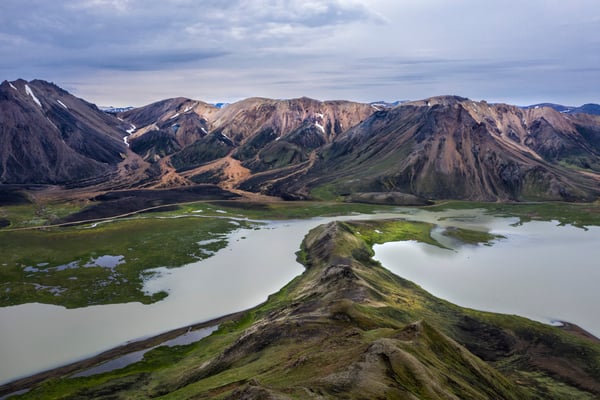 landscape along the road to Landmannalaugar base camp. The area is a popular tourist destination due to the presence of interesting geological formations, such as the multicolored rhyolite mountains, large expanses of lava and hot springs. 