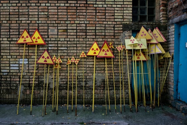 Fresh painted radiation warning signs ready to be put around the zone, Pripyat city. In the ghost  town of Pripyat, inside Chernobyl Exclusion Zone, there is a factory where workers paint the radiation warning signs worn by time and weather. 